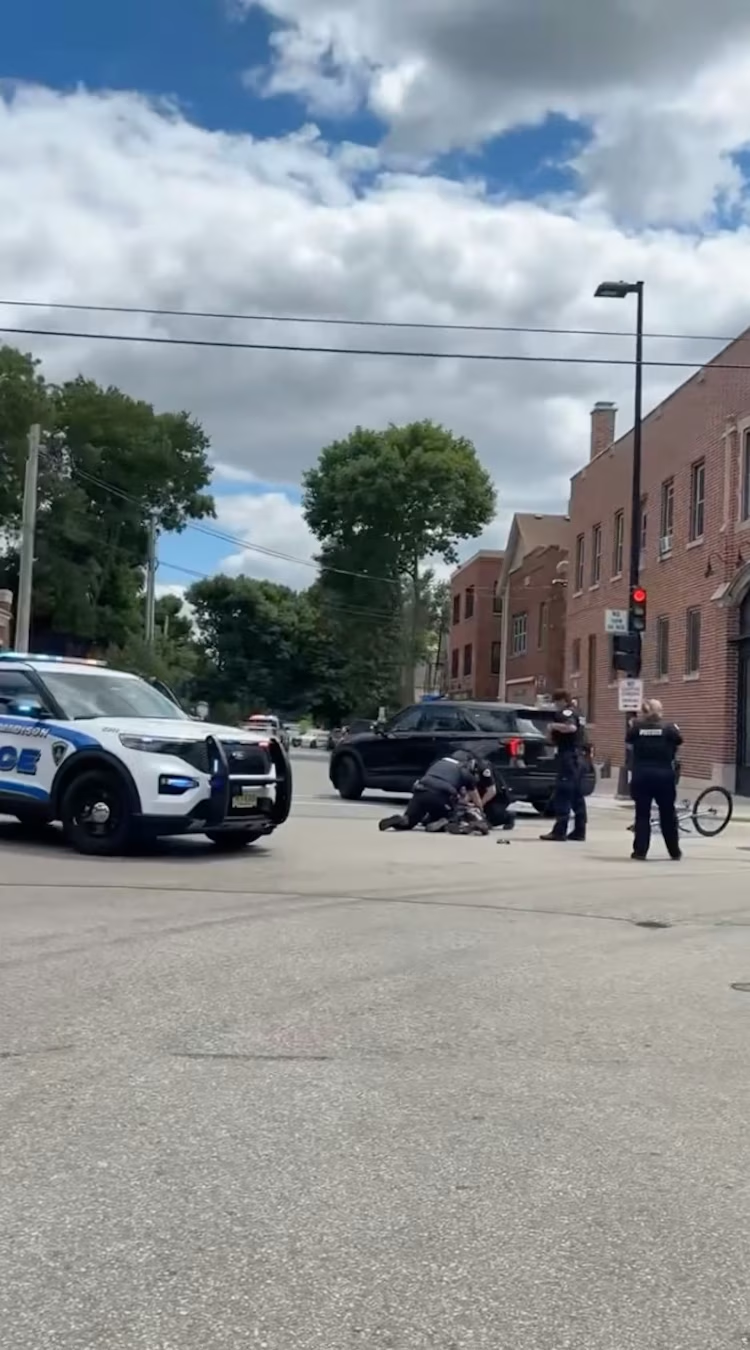 Madison officers restrain a man during the street confrontation