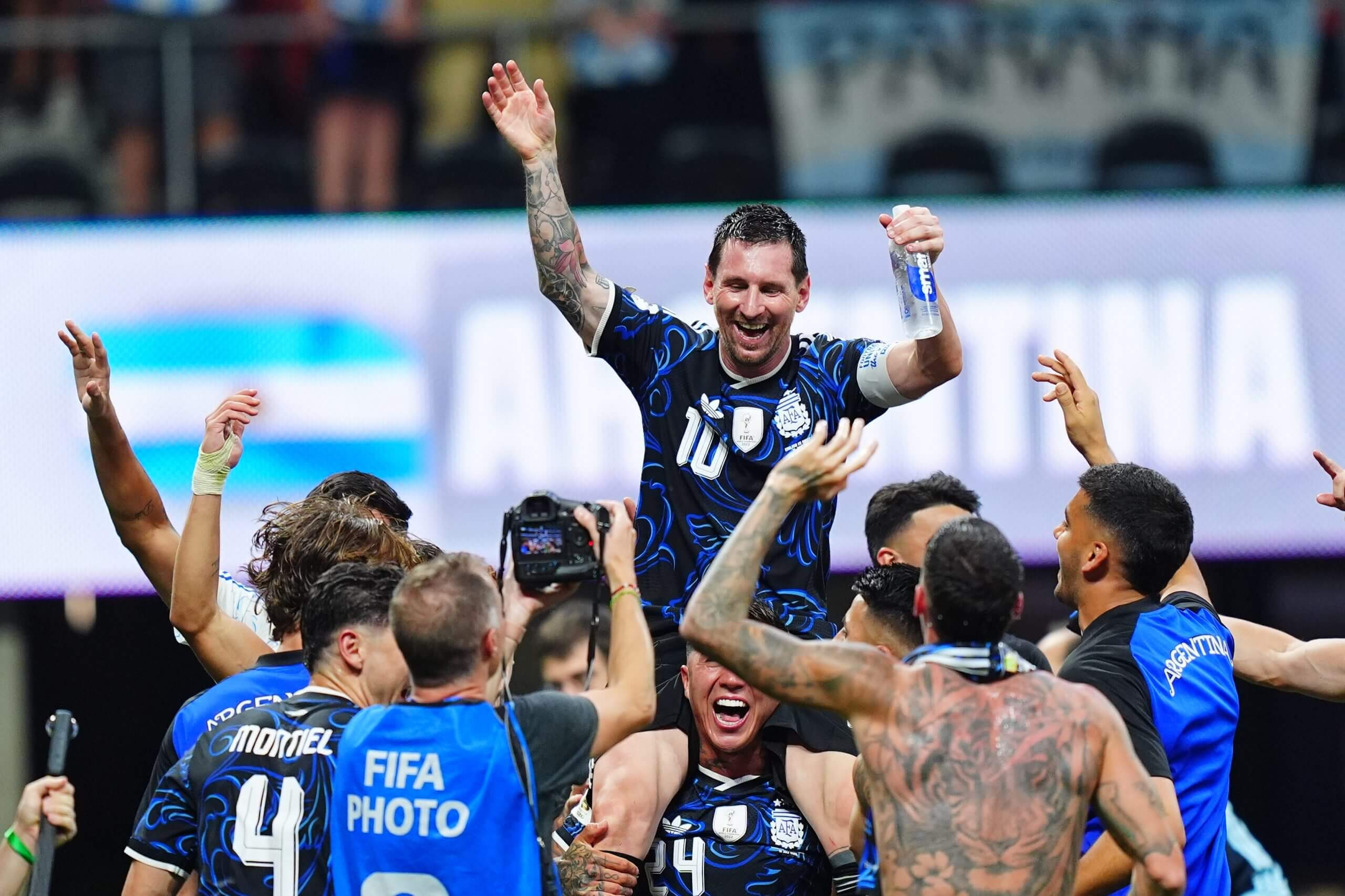 Lionel Messi celebrates with Argentina teammates after reaching the World Cup final